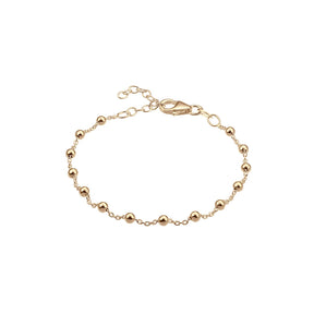 smalt guldarmband med små kulor